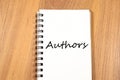 Authors write on notebook Royalty Free Stock Photo