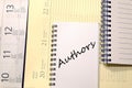 Authors write on notebook Royalty Free Stock Photo