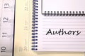 Authors write on notebook Royalty Free Stock Photo
