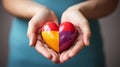 Autism awareness - childs hands holding puzzle heart in support of autism spectrum Royalty Free Stock Photo