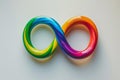 Autism awareness. rainbow infinity symbol for neurodiversity support on white background Royalty Free Stock Photo