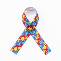 Autism awareness ribbon in puzzle or jigsaw pattern isolated on white background with clipping path for World Autism Awareness Royalty Free Stock Photo