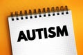 Autism - neurodevelopmental disorder characterized by difficulties with social interaction and communication, text concept on