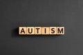 Autism - word from wooden blocks with letters
