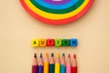 Autism word wooden colorful cubes and rainbow. Mental health, social suport. Special education concept