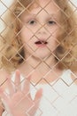 Autistic Child Blurred Behind Pane Of Glass Royalty Free Stock Photo