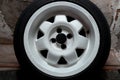 Used white titanium rims and tires with excellent tread await spring