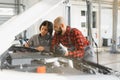 Auto car repair service center. Mechanic examining car engine. Female Mechanic working in her workshop. Auto Service Business Royalty Free Stock Photo