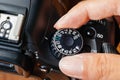 Auto dial mode on dslr camera with fingers on the dial Royalty Free Stock Photo