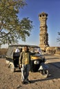 Auto driver and Guide standing near tower of Chittorgarh