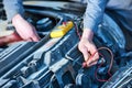 Auto electrician mechanic at work with car