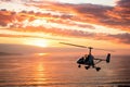 Auto-Gyro Over the Pacific Ocean at Sunset