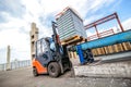 Auto loader with concrete blocks near house-building factory Royalty Free Stock Photo