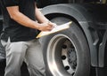 Auto Mechanic is Checking the Truck`s Safety Maintenance Checklist. Inspection Safety of Semi Truck Wheels Tires Royalty Free Stock Photo