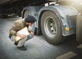 Auto Mechanic is Checking the Truck`s Safety Maintenance Checklist. Inspection Safety of Semi Truck Wheels Tires Royalty Free Stock Photo