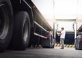 Auto Mechanic is Checking the Truck`s Safety Maintenance Checklist. Lorry Driver. Inspection Truck Safety of Semi Truck Wheels. Royalty Free Stock Photo