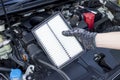 Auto mechanic hand with new car engine air filter, Car maintenance service Royalty Free Stock Photo