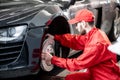 Auto mechanic servicing sports car Royalty Free Stock Photo