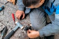 Auto mechanic repairs truck. Professional repair and diagnostics of cargo tractors and equipment. Mechanic in workshop Royalty Free Stock Photo