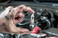 Auto mechanic and sparkplug Royalty Free Stock Photo