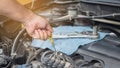 Auto mechanic with tool working check and fixed an old car engine at service station,change and repair before drive Royalty Free Stock Photo