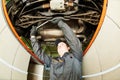 Auto mechanic at wheel alignment work with spanner Royalty Free Stock Photo