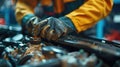 Auto mechanic working in auto repair service. Closeup of male hands in gloves repairing car engine. Royalty Free Stock Photo
