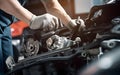 Auto mechanic working on car broken engine in mechanics service or garage.