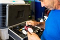 Auto mechanic working on car broken engine in mechanics service or garage. Royalty Free Stock Photo