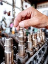 Auto mechanic working on engine components at a workshop during the day Royalty Free Stock Photo