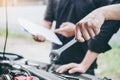 Auto mechanic working in garage Technician Hands of car mechanic working in auto repair Service and Maintenance car check Royalty Free Stock Photo