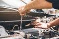 Auto mechanic working in garage Technician Hands of car mechanic working in auto repair Service and Maintenance car check