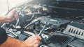 Auto mechanic working in garage Technician Hands of car mechanic working in auto repair Service and Maintenance car check