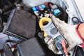 Auto mechanic working in mechanics garage, Technician checking fuse and relay on car engine, Repair and Maintenance service Royalty Free Stock Photo