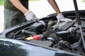 Auto mechanic working in mechanics service or garage. Royalty Free Stock Photo