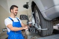 Auto mechanic working with sensor Royalty Free Stock Photo