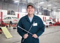 Auto mechanic with wrench. Royalty Free Stock Photo