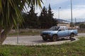 Blue rusty pickup on the street