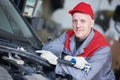 Auto repair service. Mechanic worker portrait with spanner Royalty Free Stock Photo