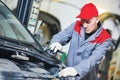 Auto repair service. Mechanic works with spanner Royalty Free Stock Photo