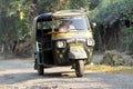 Auto rickshaw taxi on a road in Baidyapur, India