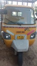 Auto rickshaw yallow colour parking empty road