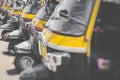 Auto rickshaws or `tuk-tuk ` taxi on a street. Selective Focus