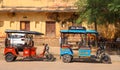 Auto rikshaws or Moto Taxies are three-wheeler vehicles a common form of urban transportation in Indian cities Royalty Free Stock Photo