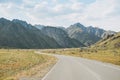 Auto road against the beautiful mountain landscape, Chemalsky tract, Altai