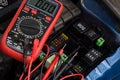 Digital multimeter testing car electronics Royalty Free Stock Photo