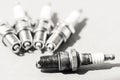 Auto service. Set of spark plugs as spare part of car. Royalty Free Stock Photo