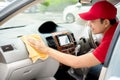 Auto service staff cleaning car interior Royalty Free Stock Photo