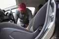 Auto service staff cleaning car interior