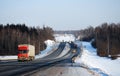 Auto trucks length gages go on Minskoye Highway in the winter clear morning. Royalty Free Stock Photo